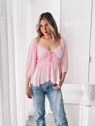 Women's pink peplum top with sweetheart neckline by Esther & Co