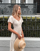 Celie Dress in Beige beige linen midi with frill skirt full length view