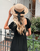Celie black tiered linen midi dress, styled view