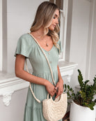 Celie Dress in Sage sage linen tiered midi dress back view