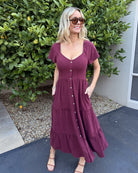 Front view of the Celie Bordeaux Linen Midi Dress showing the V-neckline and flowing A-line silhouette