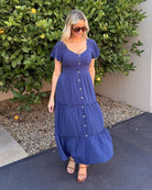 Celie navy tiered linen midi dress, styled view