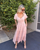 Celie pink tiered linen midi dress, styled view