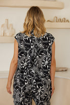 Women's black and white print sleeveless shirt styled casually by Esther & Co