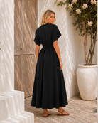 Women's black v-neck maxi dress with statement front buttons, the Clairice Dress in Black by Esther & Co