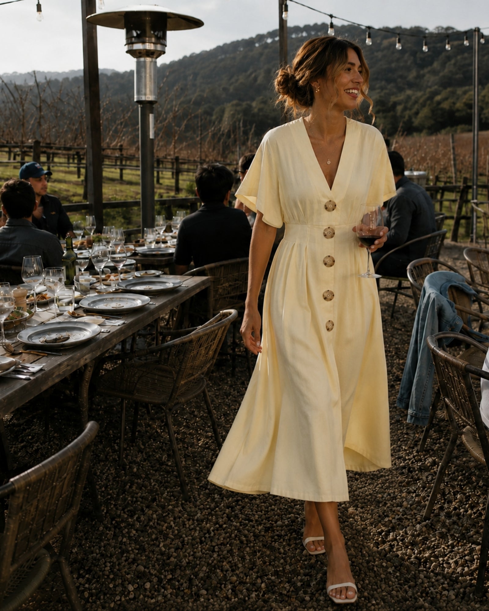 Women's buttercream yellow pleated maxi dress with statement front buttons, the Clairice Dress in Buttercream by Esther & Co