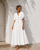 Women's white pleated maxi dress with statement front buttons, the Clairice Dress in White by Esther & Co