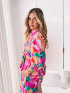 Women's pink fiesta print peplum top with sweetheart neckline, the Conley Top in Pink Fiesta by Esther & Co