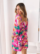 Women's pink floral print peplum top with bubble sleeves by Esther & Co
