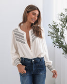 Dareia Blouse in Cream Print womens cream print blouse tucked into trousers