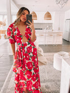 Women's pink floral maxi dress styled for a garden party by Esther & Co
