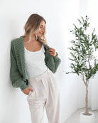 Full length view of the Dorine Cardigan in Forest Green by Esther and Co showing the relaxed longline silhouette