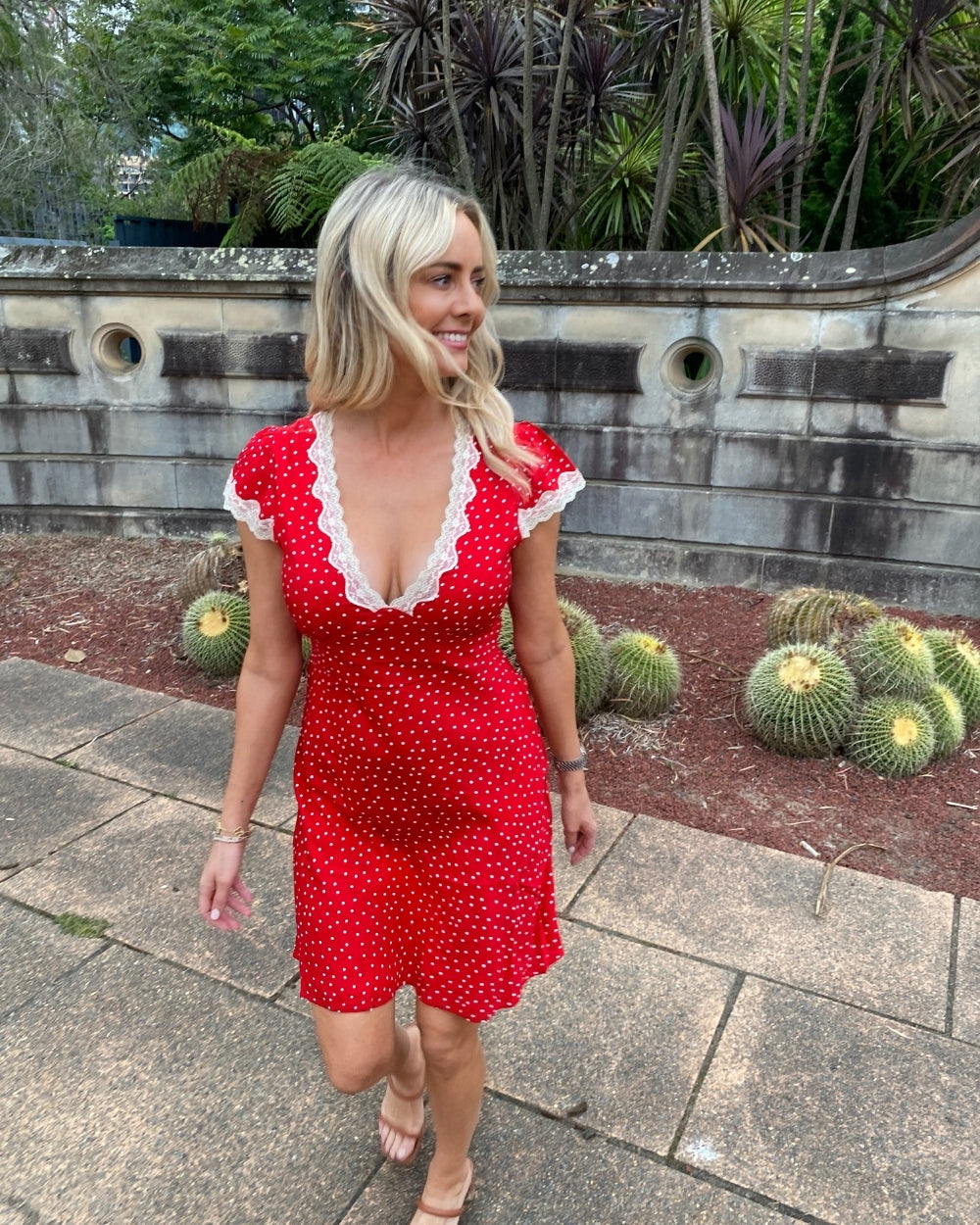 Women's red polka dot mini dress full length view by Esther & Co
