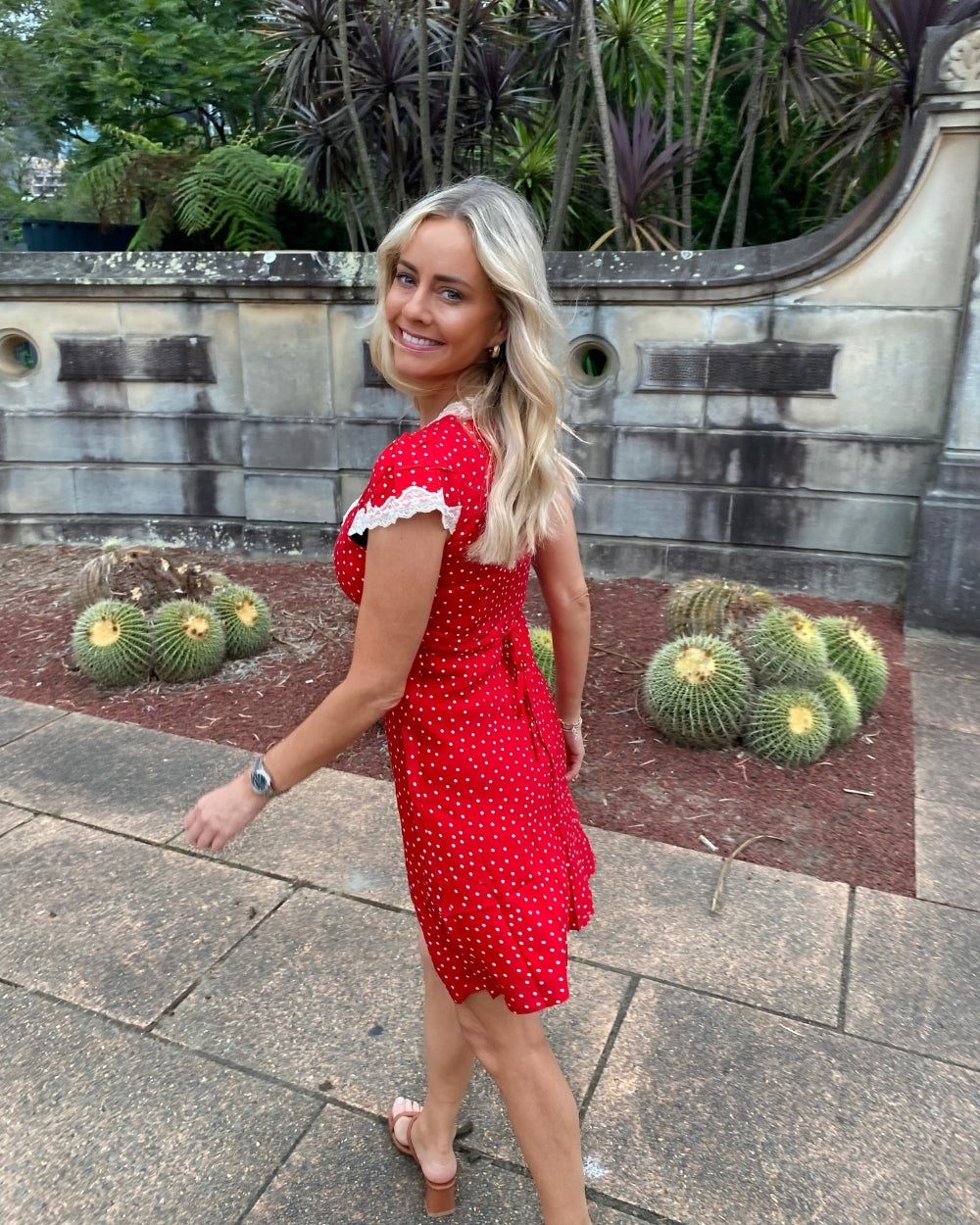 Women's red and white polka dot mini dress front view by Esther & Co