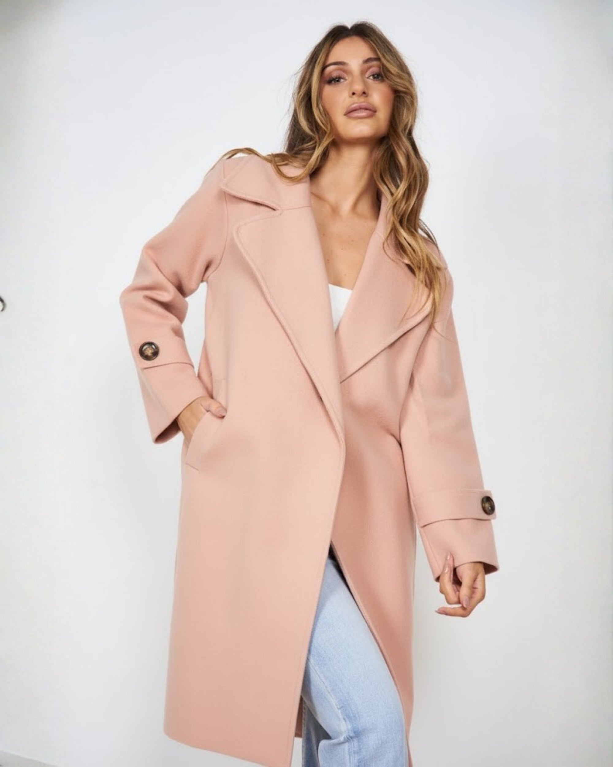 Women wearing the Fireplace Coat in Pink, a soft medium-weight knit trench coat with open-front silhouette