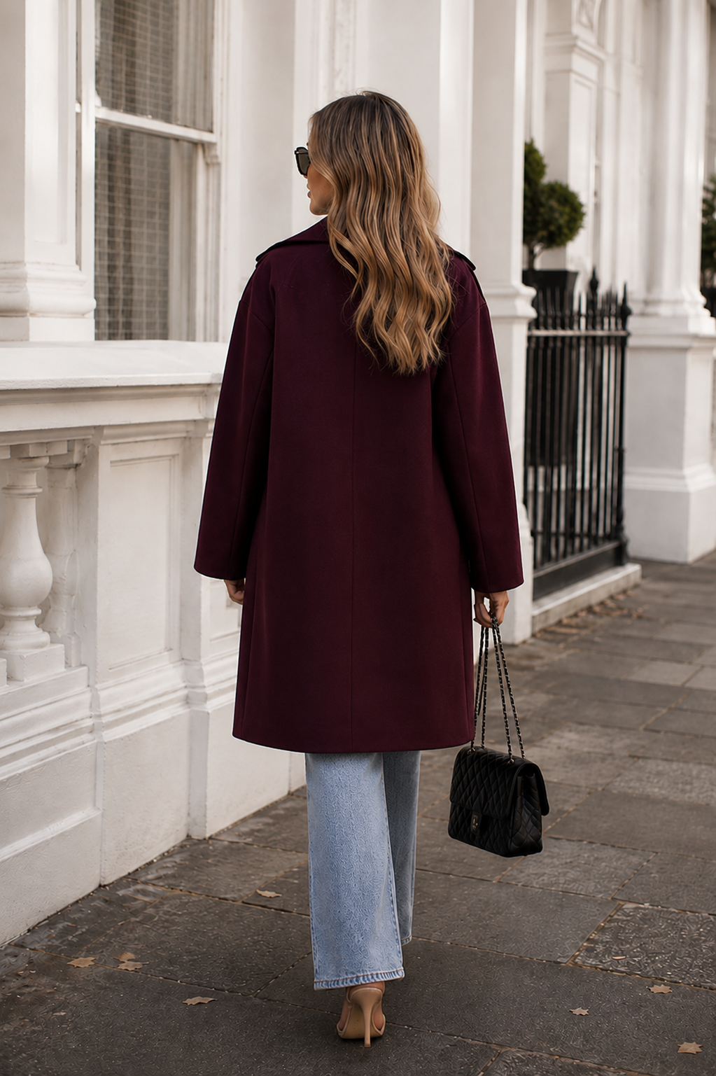 Women's plum knit trench coat shown from the back, the Fireplace Coat in Plum by Esther & Co