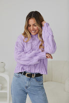 Side view of the Hadi Knit in Lilac showing the longline silhouette and soft acrylic fabric