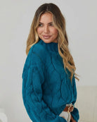 Front view of the Hadi Teal Knit showing the high round neckline and textured knit fabric