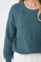 Full length view of the Harvie Knit in Petrol by Esther and Co showing the rich teal colour and relaxed silhouette
