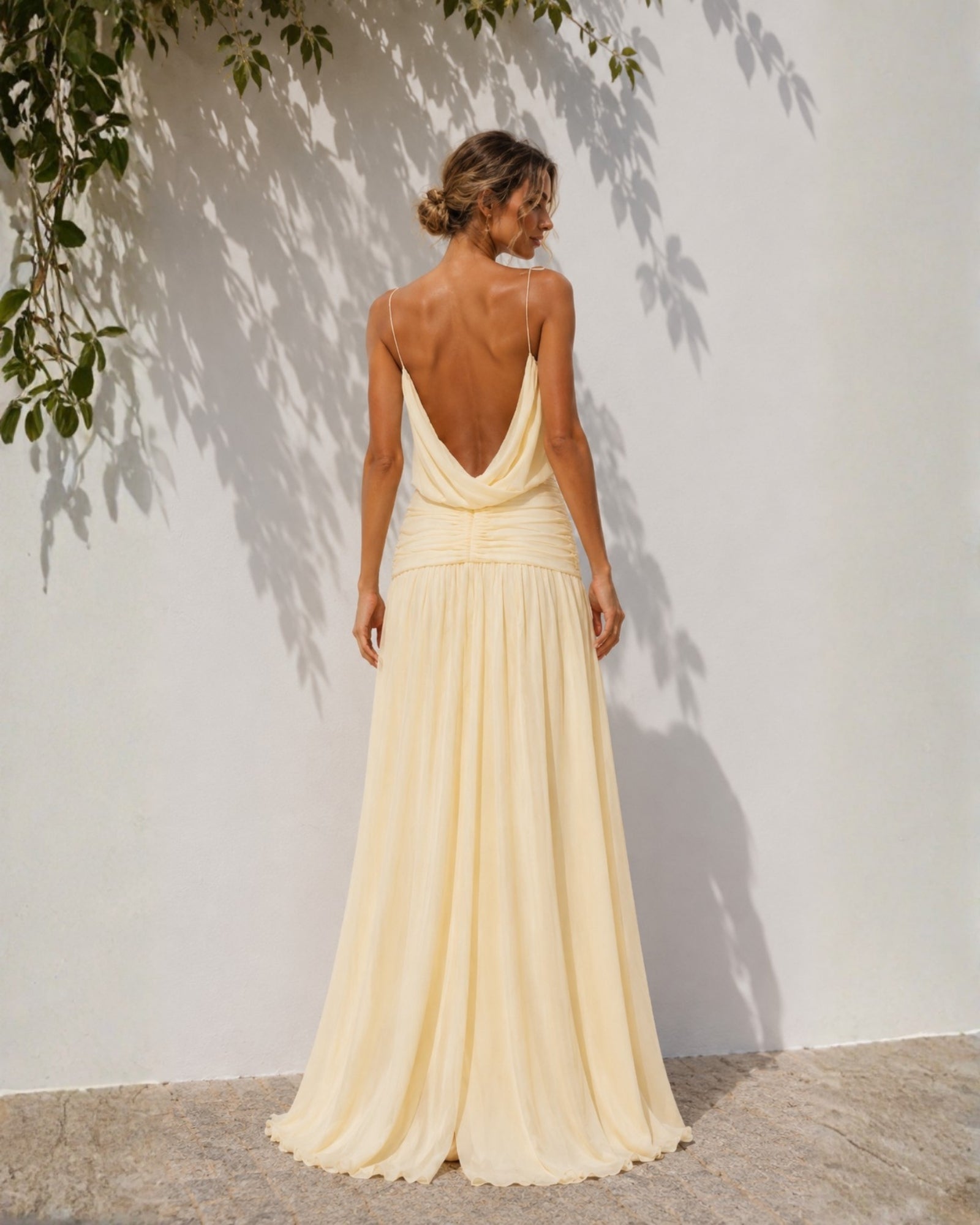 Women's pastel yellow backless maxi dress, the Hermione Dress in Sunlit Veil by Esther & Co