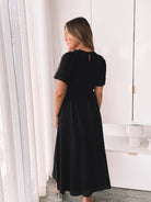 Back view of the Iolana Black Smock Midi Dress by Esther and Co