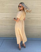 Front view of the Iolana Beige Smock Midi Dress showing the textured detail and relaxed A-line silhouette