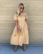 Iolana Dress in Beige womens beige cotton smock midi dress close up texture detail