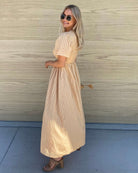 Iolana Dress in Beige neutral beige smock midi dress back view