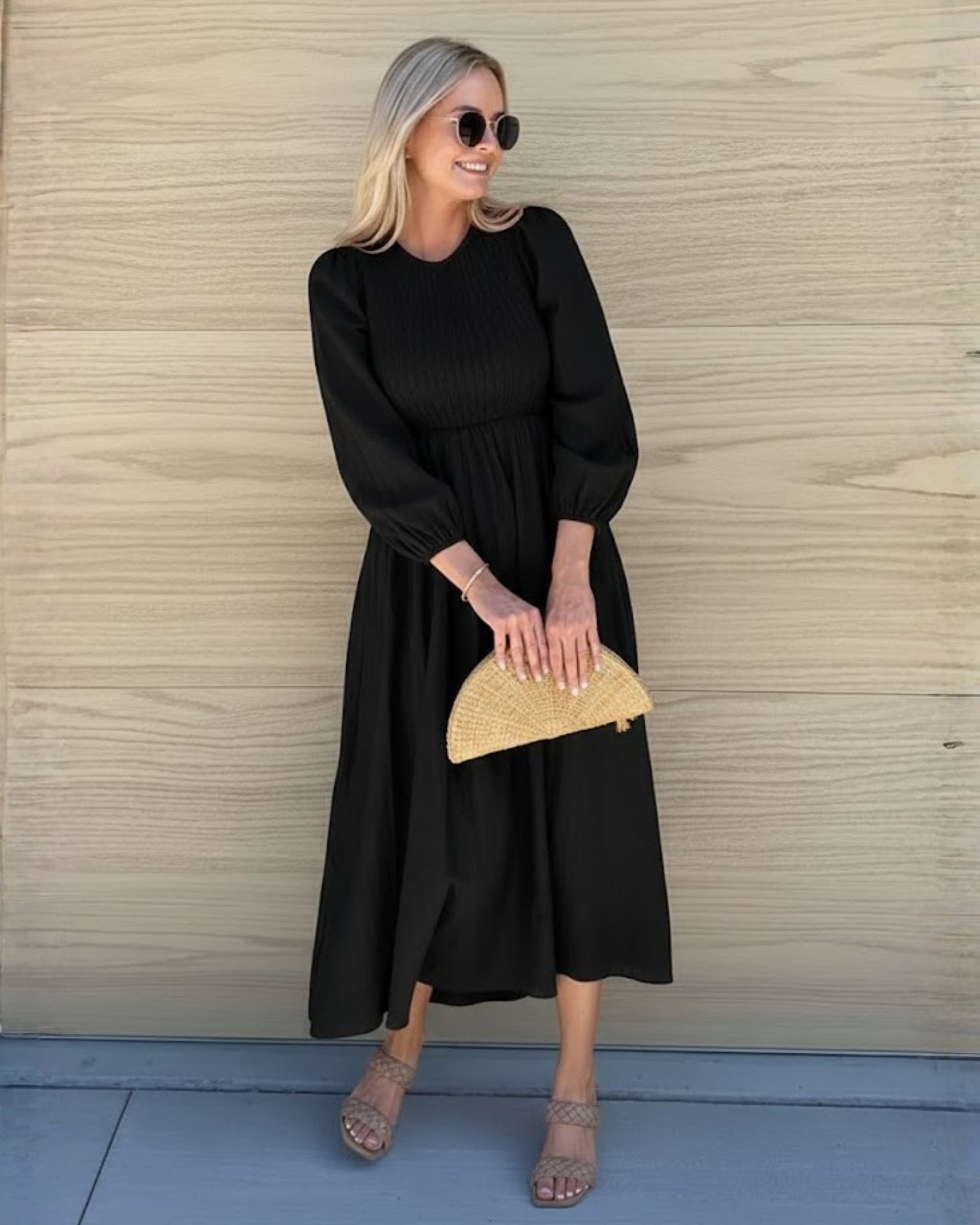 Front view of the Iolana Black Long Sleeve Midi Dress showing the round neckline and textured A-line fit