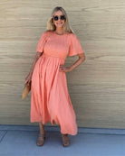 Women's coral cotton midi dress with smocked bodice, the Iolana Dress in Coral by Esther & Co