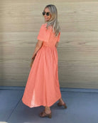 Women's flowy coral cotton dress with vertical stripe texture by Esther & Co