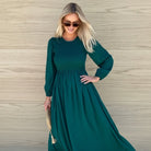 Iolana Dress in Deep Green Long Sleeve deep green shirred bodice cotton midi dress side view