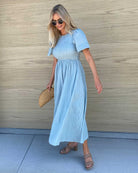 Front view of the Iolana Sage Smock Midi Dress showing the textured chest detail and A-line silhouette