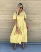 Women's yellow midi dress with double layered flutter sleeves by Esther & Co