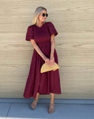 Iolana Dress in Wine womens cotton smock midi dress in rich wine red front view