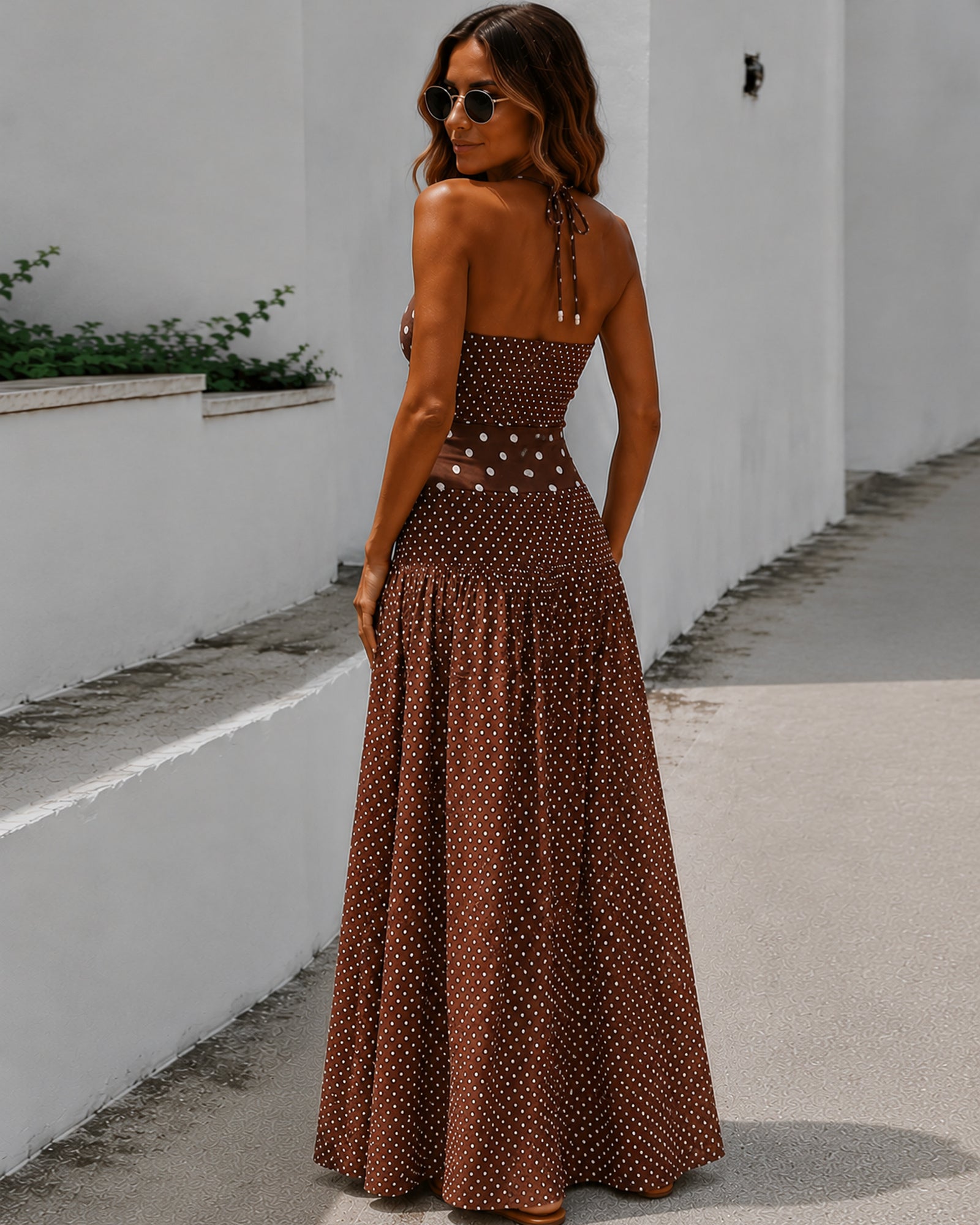 Women's brown polka dot maxi dress with shirred bodice side view by Esther & Co