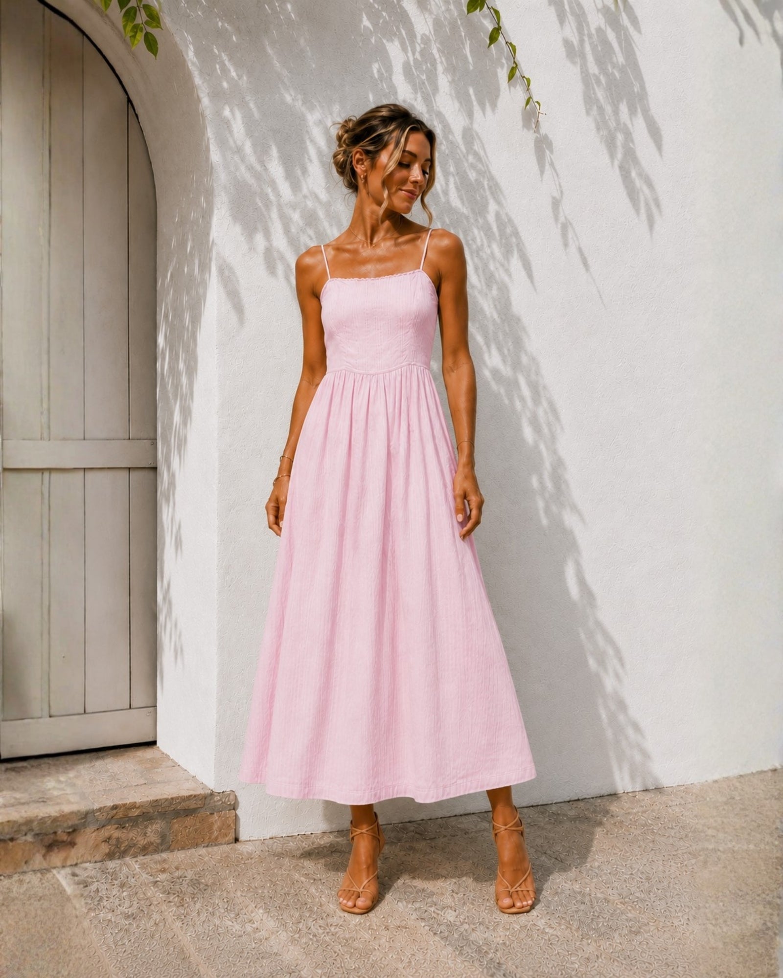 Women's pastel pink midi dress with adjustable spaghetti straps by Esther & Co