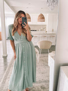 Back view of the Korbela Sage Linen Midi Dress by Esther and Co