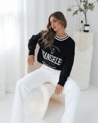 Kanoe Knit in Black Print black base with white text print knit side view