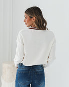 Kanoe Knit in Cream Print cream and red text print wool blend knit full length