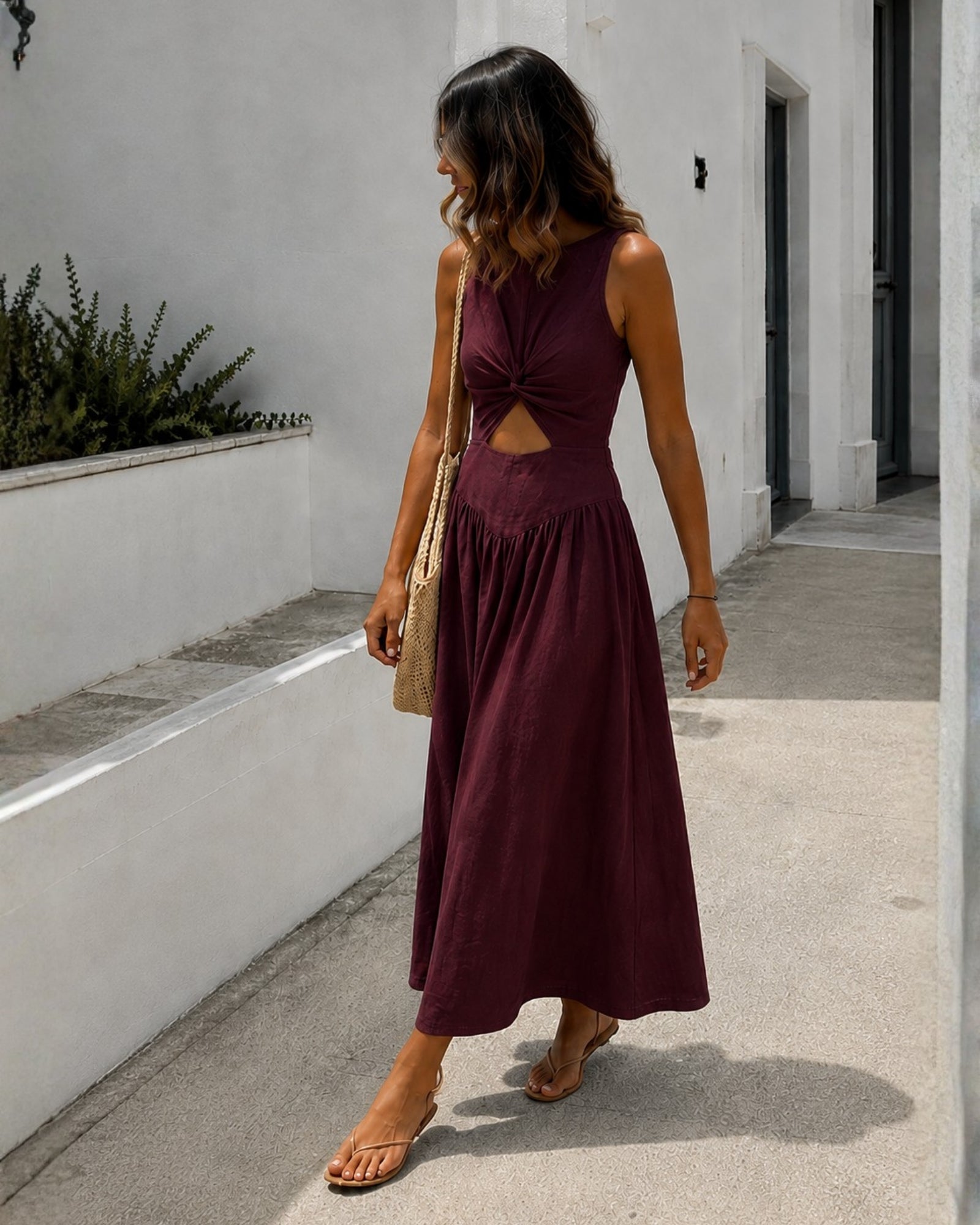 Women's plum sleeveless linen midi dress side view, the Kirah Dress in Plum by Esther & Co