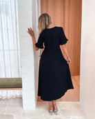 Full length view of the Korbela Black Linen Midi Dress by Esther and Co showing the versatile A-line fit