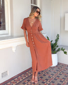 Korbela Dress in Rust womens linen midi dress in burnt rust front view