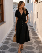 Women's black linen midi dress with V neckline and button-up front, the Korbela Dress in Black by Esther & Co