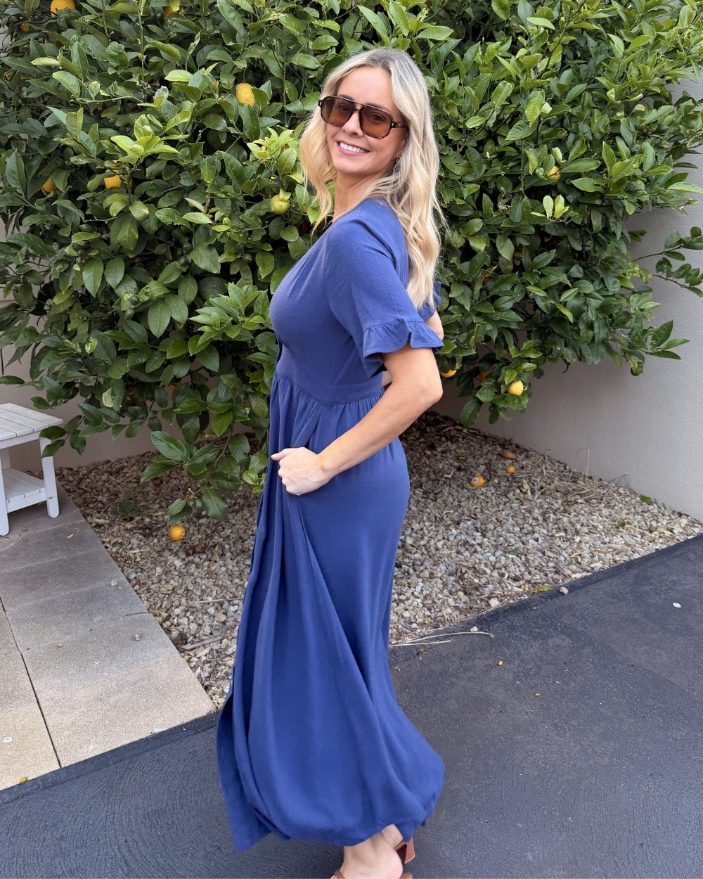 Front view of the Korbela Navy Linen Midi Dress showing the V-neckline and relaxed A-line fit