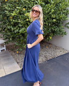 Front view of the Korbela Navy Linen Midi Dress showing the V-neckline and relaxed A-line fit