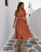 Women's rust linen midi dress with V neckline and button-up front, the Korbela Dress in Rust by Esther & Co