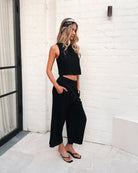 Women's high waisted black linen wide leg pants styled for everyday wear by Esther & Co