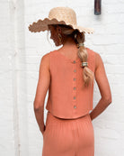 Back view of the women's rust linen crop top showing the button up detail by Esther & Co