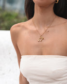 Women's gold bow pendant necklace, the Maisha Gold Necklace by Esther & Co